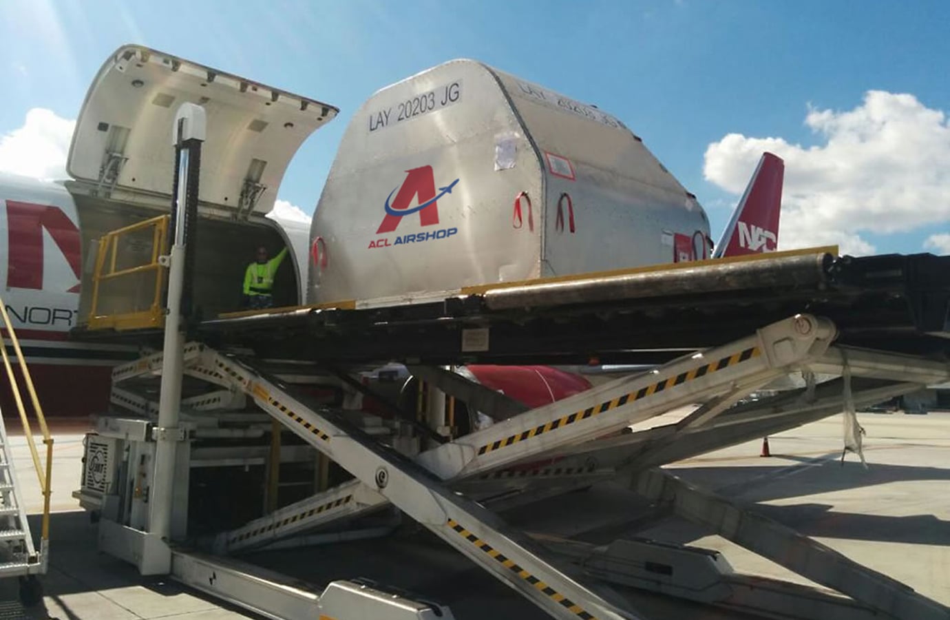 Air cargo containers being loaded onto an aircraft, representing ACL Airshop's cargo equipment