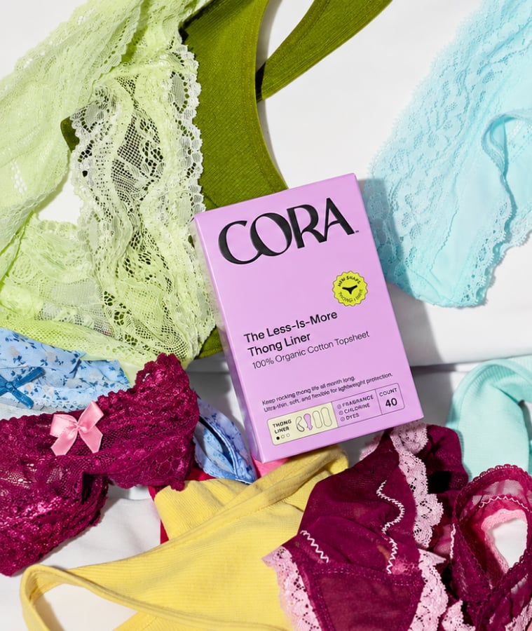 Cora period care box with colorful period underwear on a white surface