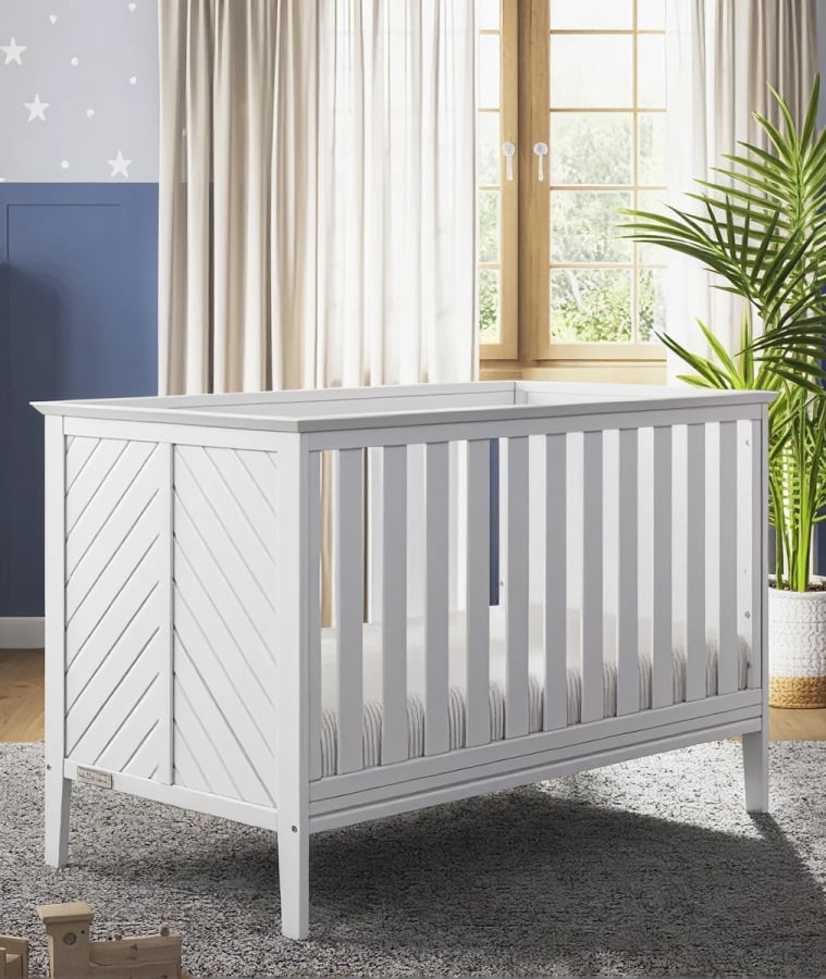 White crib in a bright, modern nursery