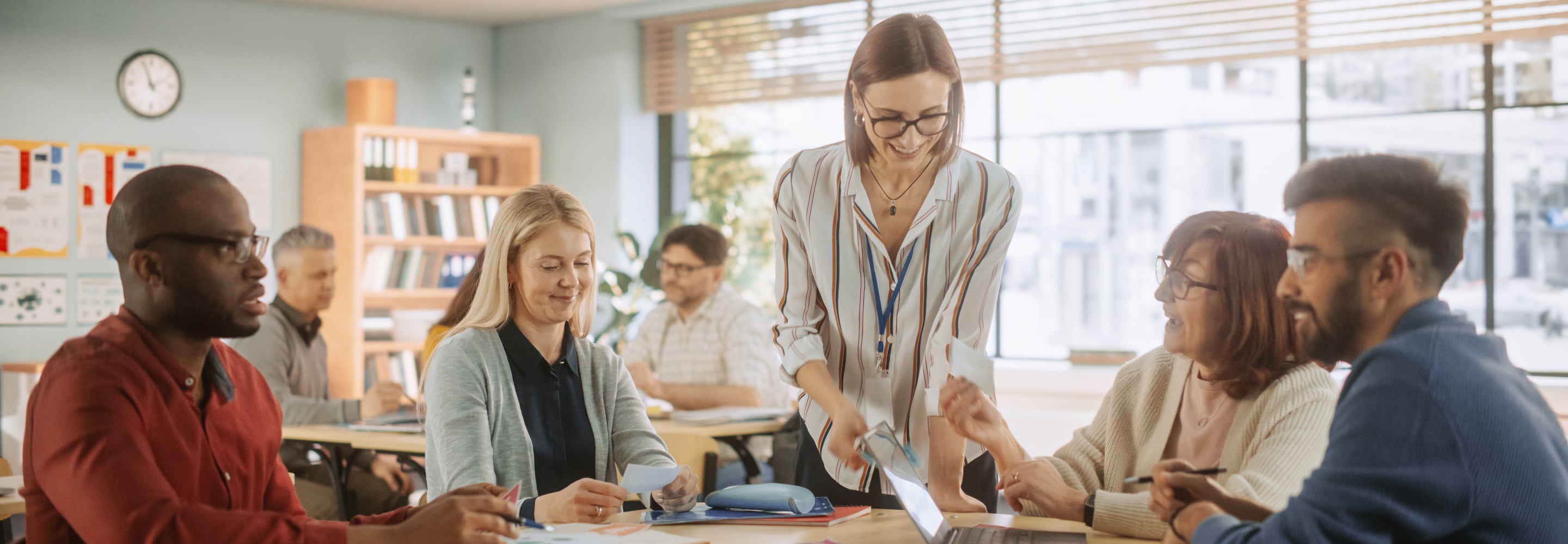 Professionals taking part in a collaborative training session around a table