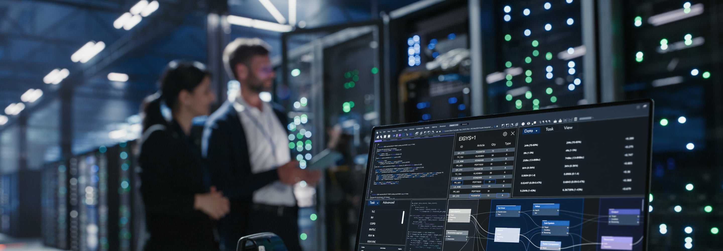 IT professionals working in a data center with server racks and a monitoring screen