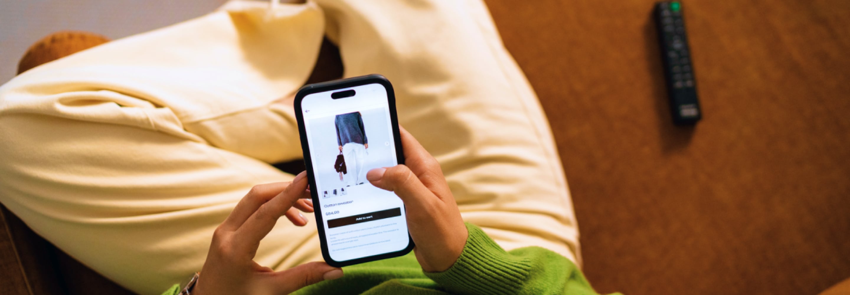 Shopper browsing a clothing product on a smartphone