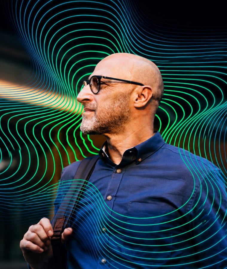Businessman looking at flowing digital data lines