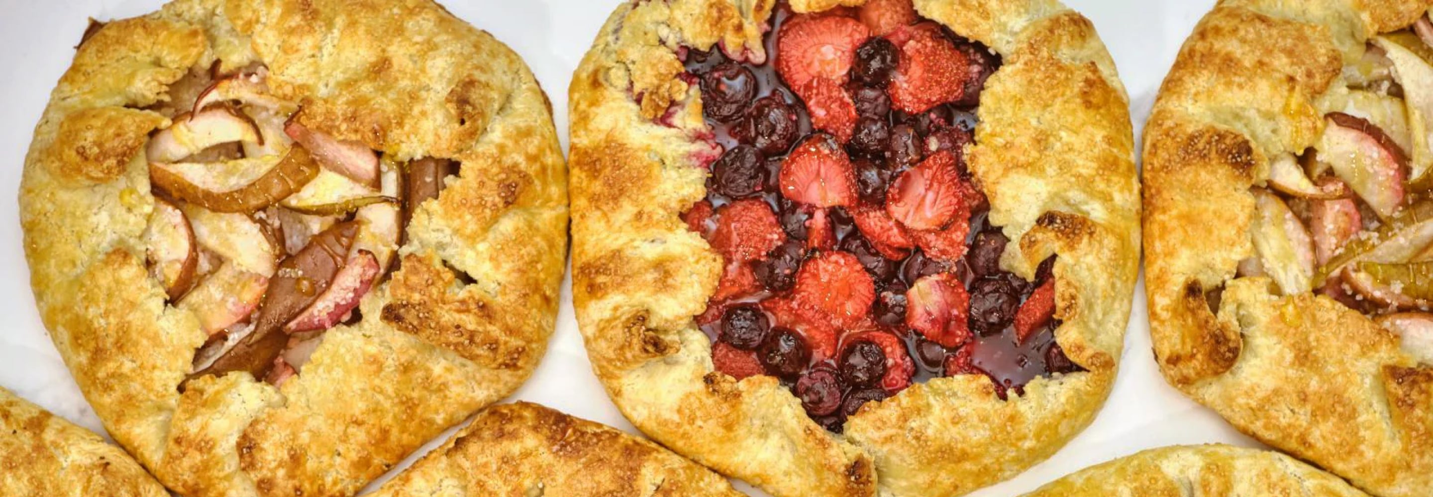 Rustic fruit galettes with berries and golden crust